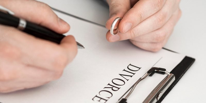 close-up-man-thinking-sign-divorce-contract_23-2148536075